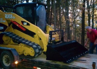 skid steer on trailer